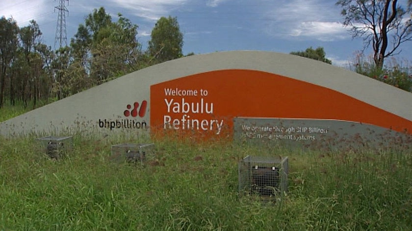 Generic TV still of 'welcome to Yabulu refinery' sign with bhp billiton logo on it in Townsville.