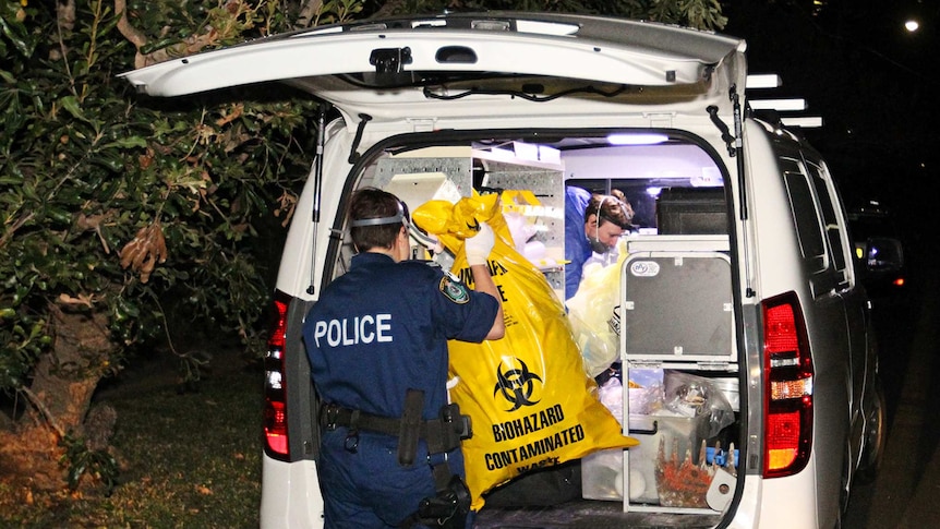 Police work at an address in Greenwich where a body has been found.