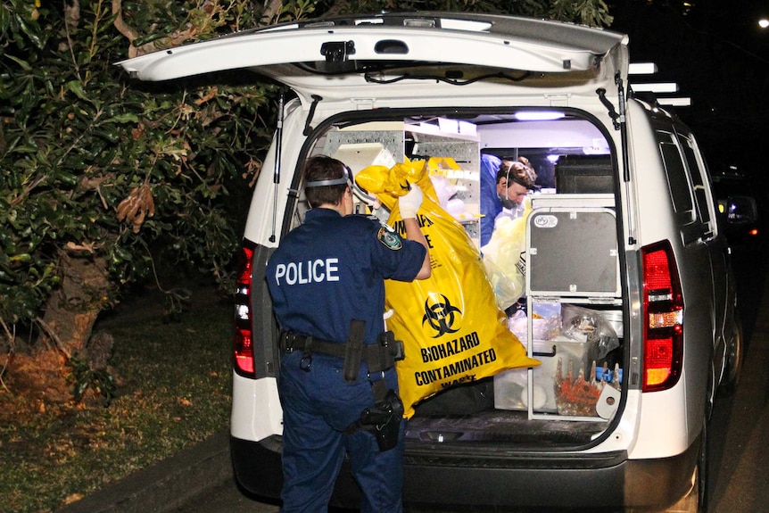 Police work at an address in Greenwich where a body has been found.