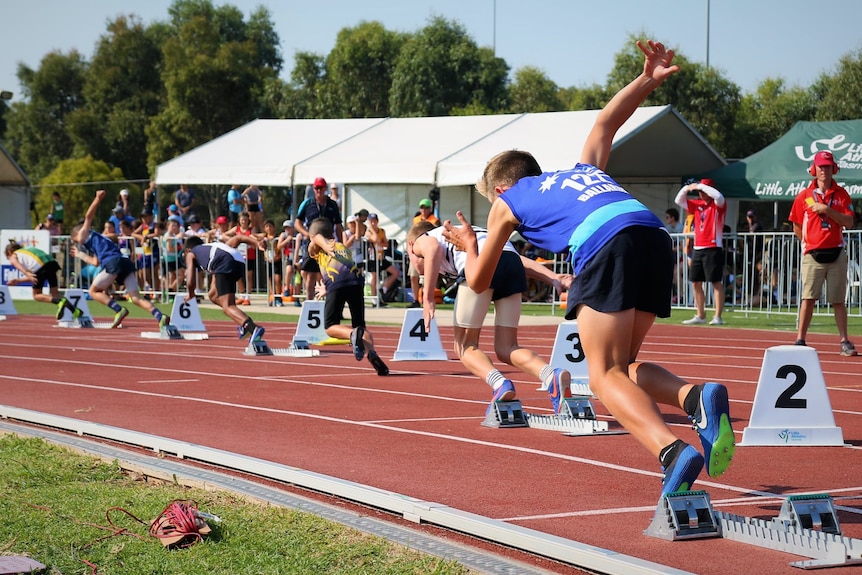 Little Athletics competitors in a 200 metres race.