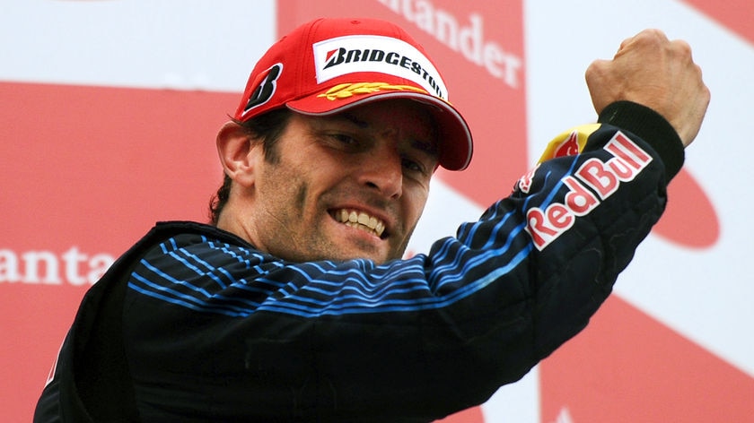 'Incredible day': Mark Webber celebrates on the podium after breaking through for his maiden win.