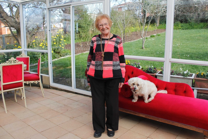 Joan Webb with her dog 'Billie' in her Riverside home