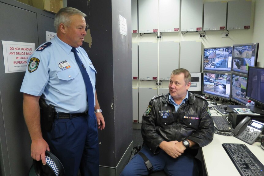 The new head of regional police, Deputy Commissioner Gary Worboys, chats to a Dubbo officer