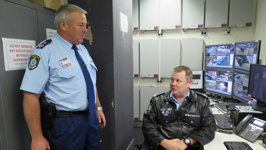 The new head of regional police, Deputy Commissioner Gary Worboys, chats to a Dubbo officer