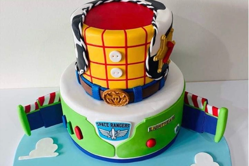 A large Toy Story themed cake incorporating Woody and Buzz Lightyeat.