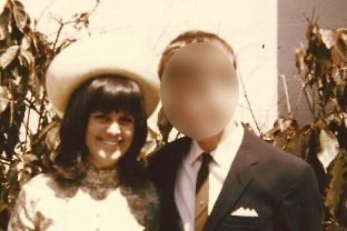 A woman smiles with an unidentified man in a photo from 1968.