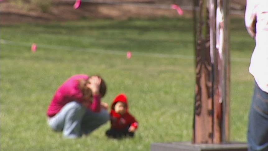 Blurred image of woman and child in a park