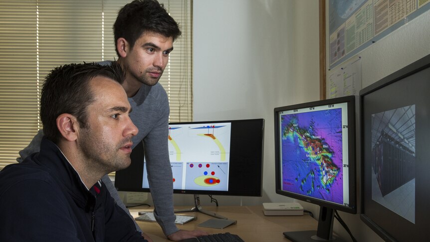 Dr Rhodri Davies and PhD student Tim Jones from the ANU research School of earth Sciences, looking at a map on a computer screen