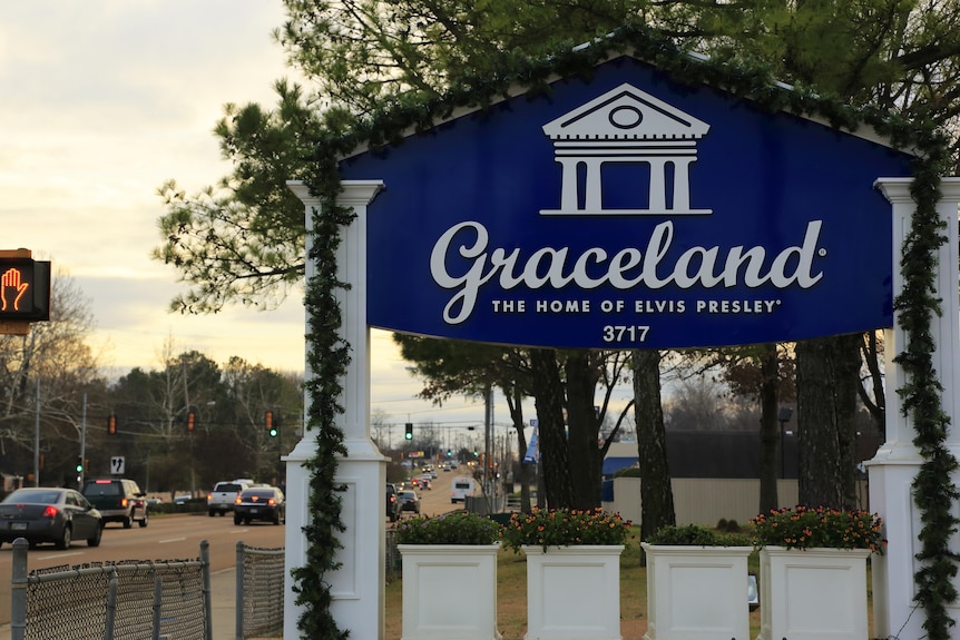 A sign that says Graceland by the road in Memphis
