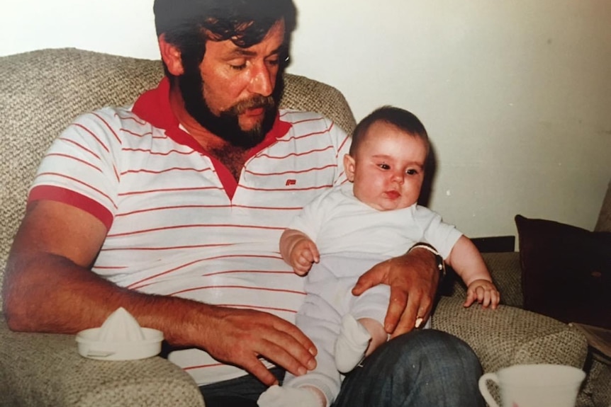 Family photo of Ruth Niemiec as a baby being held by her father