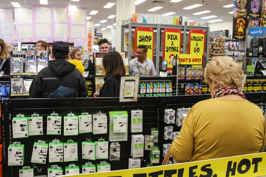 Shoppers queue at checkouts