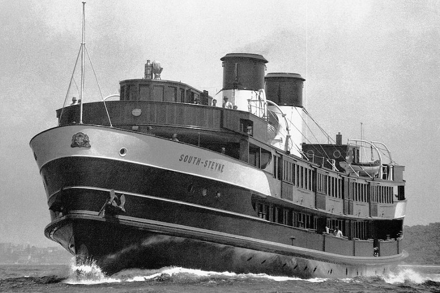 A black-and-white photograph of a large steam ferry at sea.
