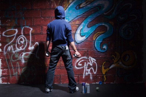 Westie stereotypes: teenager with cans of spray paint (Getty Images: Jupiterimages)