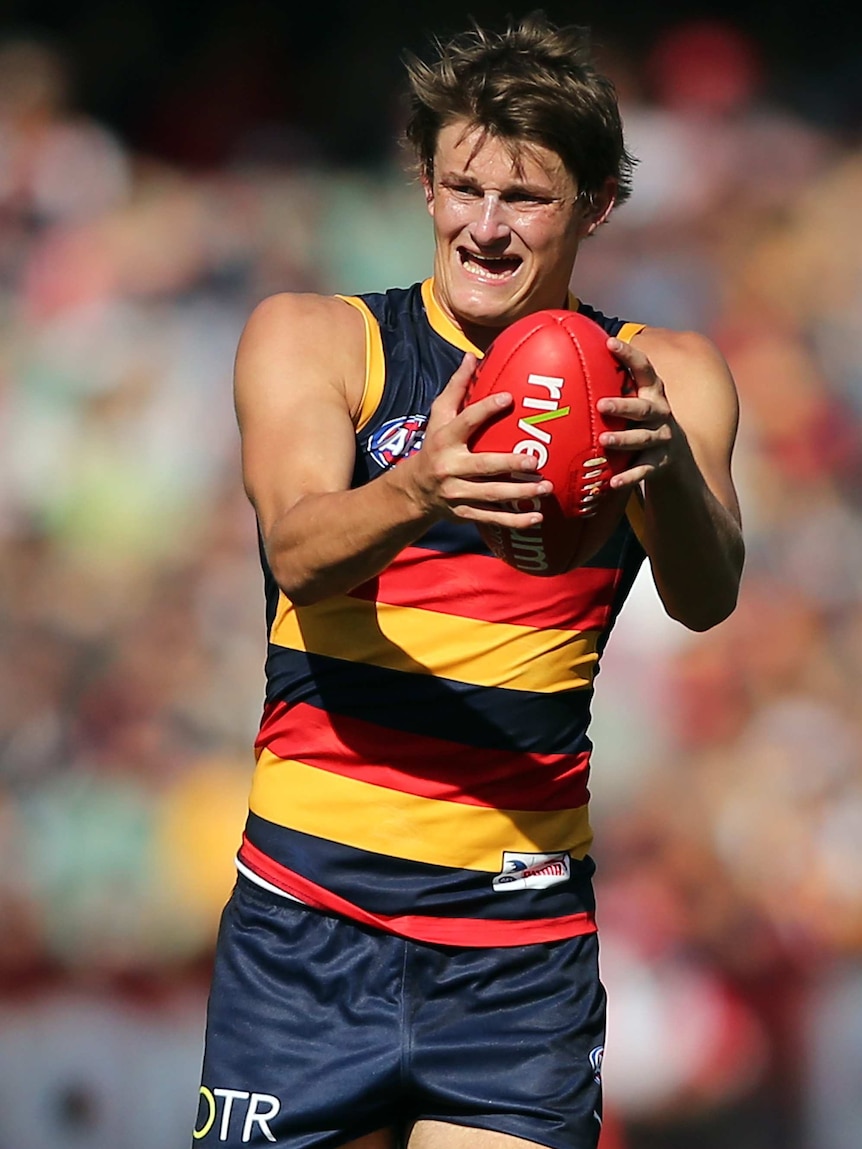 Matt Crouch in action for Adelaide
