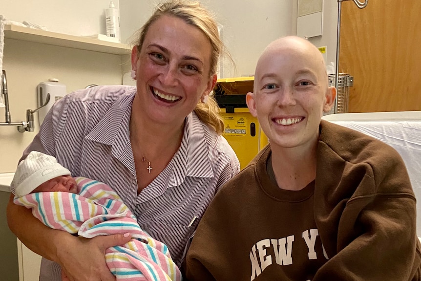 Mater Clinical Nurse Consultant Esther White with Mum Sarah Shaddick and baby Halle in hospital.