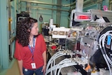 Researcher Rachel Popelka-Filcoff watches the x-ray machine scan a shield in Melbourne.