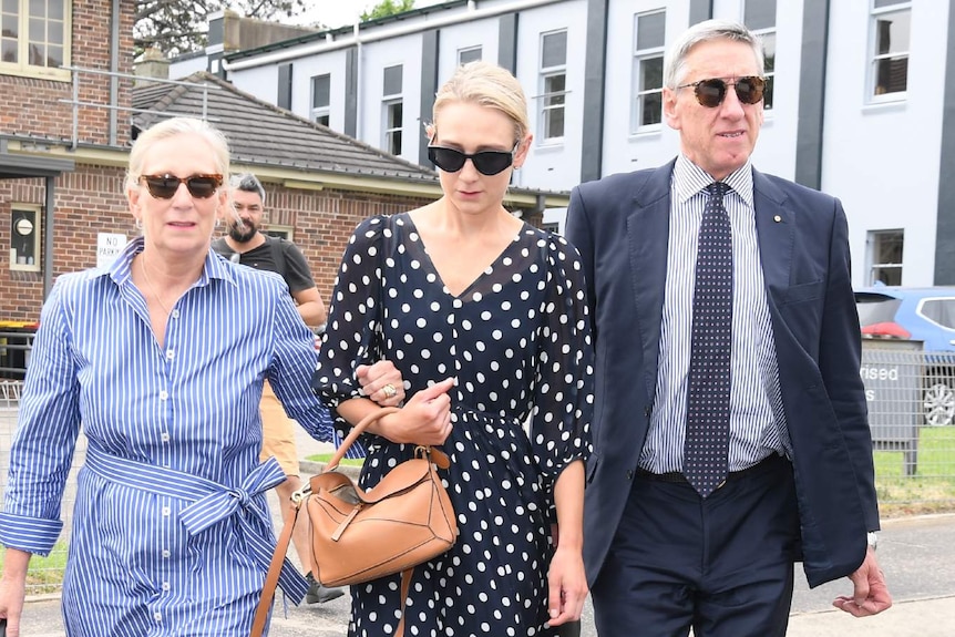 Three people wearing sunglasses