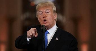 Donald Trump points a finger during a press conference at the White House.