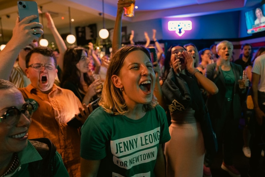 people screaming out and laughing as the vote is counted