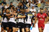 Heavy loss ... The Brumbies celebrate a try against the Reds in round one
