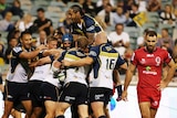 Heavy loss ... The Brumbies celebrate a try against the Reds in round one