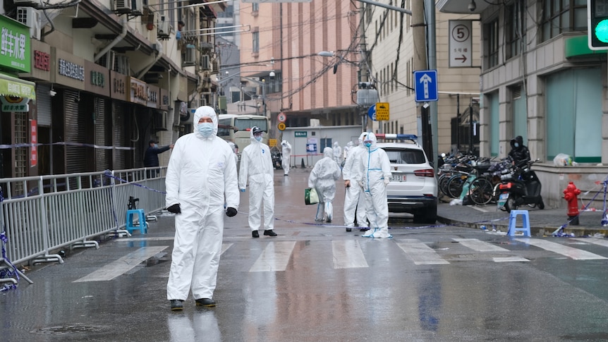 Medical staff in white hazmat suit on Shanghai street China