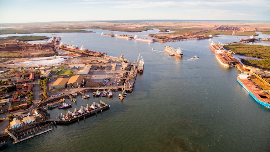 Aerial image of the tug pens and bulk carriers at a port
