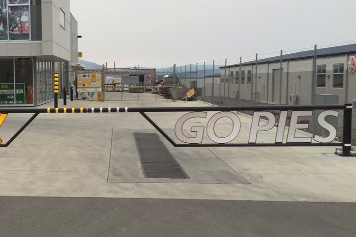 Metal large gate that reads "Go Pies" 