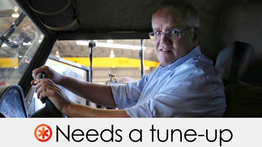 ScoMo behind the wheel of a large automibile.