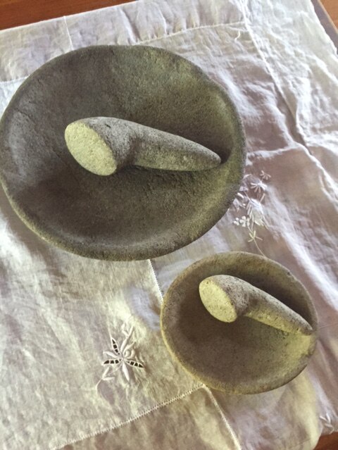 Two stone mortar and pestle sets.