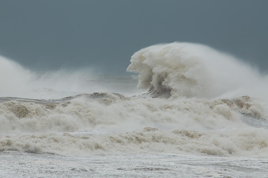 A giant backwash off Burnie wharf catches the wind