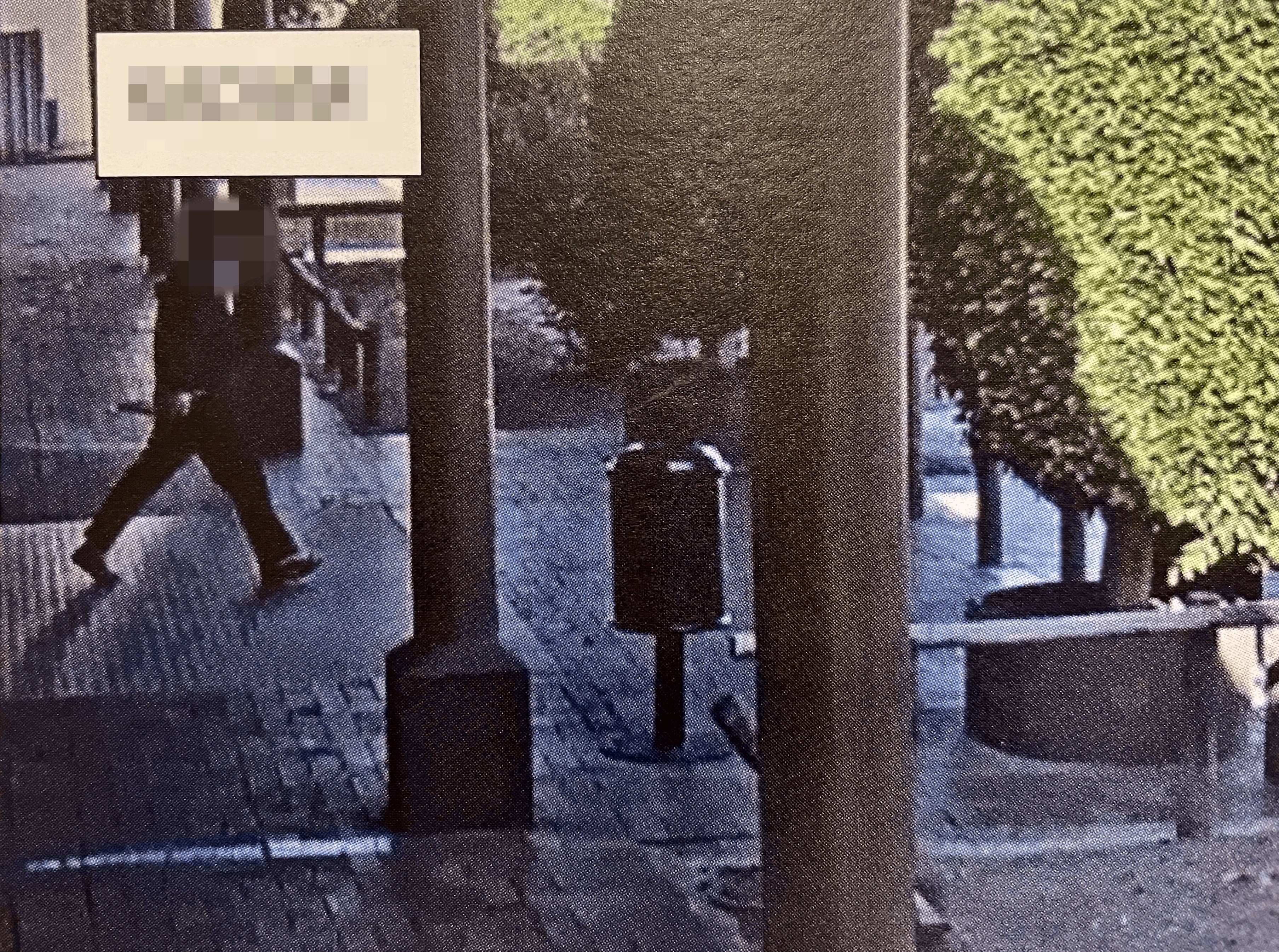 A CCTV still shows perpetrator walking and holding what police allege is a knife.
