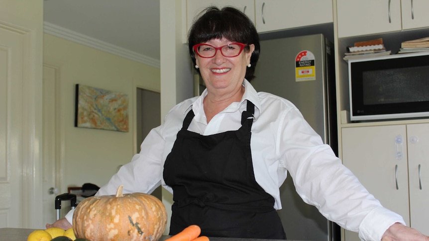 Linda Danvers with some vegetables in her Mackay kitchen