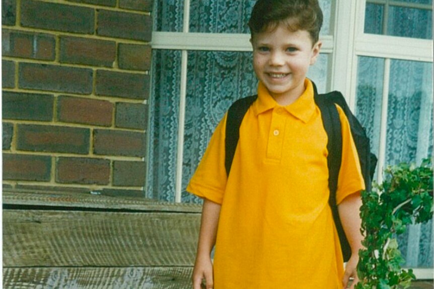 Matt Runnalls as a child, dressed in a yellow polo.