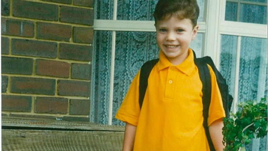 Matt Runnalls as a child, dressed in a yellow polo.