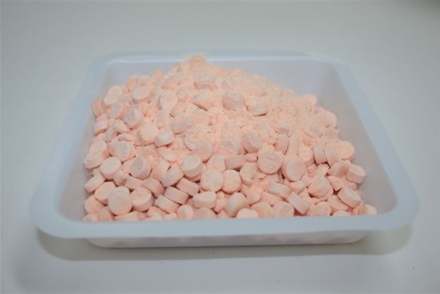 A tray of pink pills.