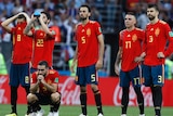 Spain's players are disappointed during the shootout loss