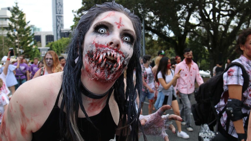A woman dressed as a zombie