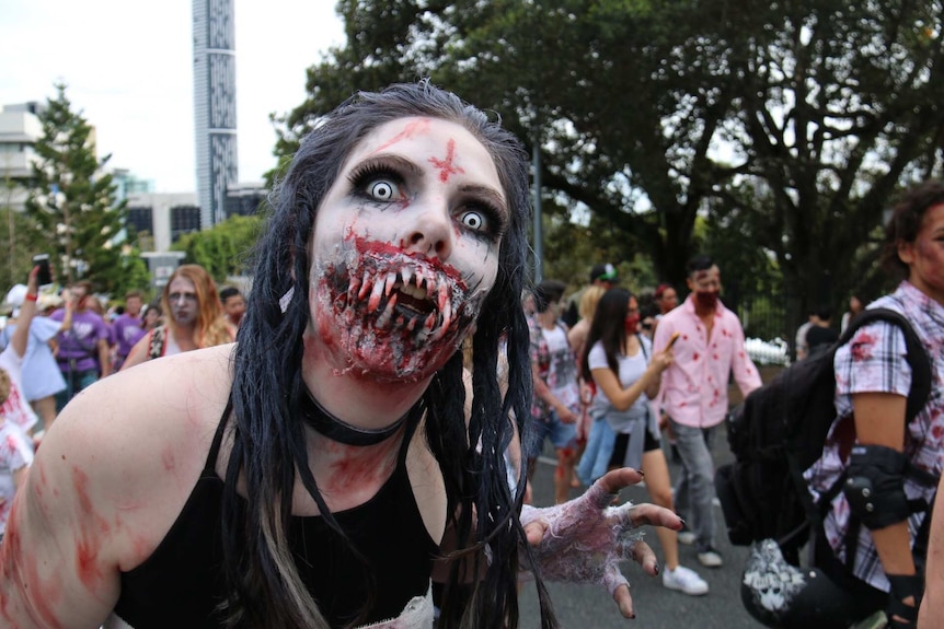 A woman dressed as a zombie