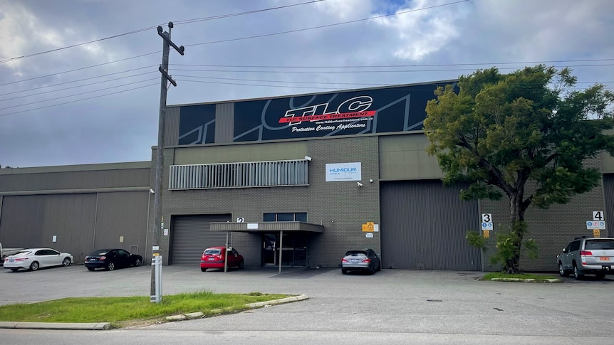 A picture of the outside of a business in an industrial area