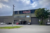 A picture of the outside of a business in an industrial area