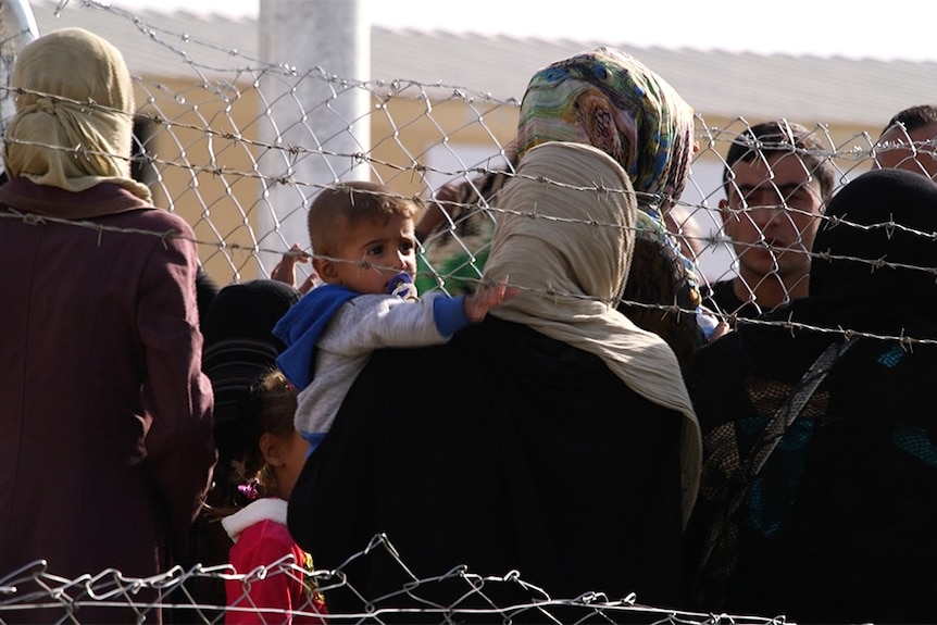 Women, children and babies in special security areas at the Debaga camp, North Iraq.