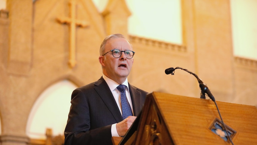 Anthony Albanese speaks inside a church