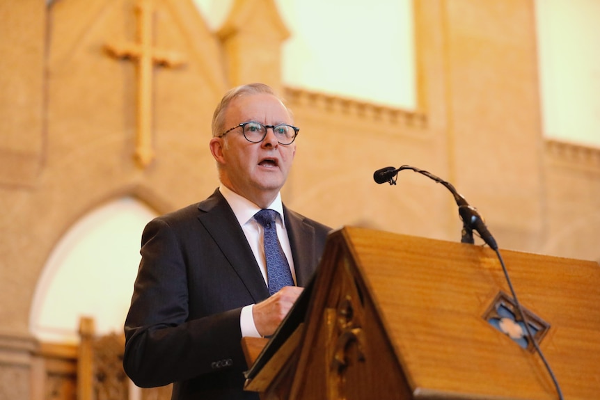 Anthony Albanese speaks inside a church
