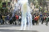 Supporters of the Party of National Unity (PNU) of President Mwai Kibaki are dispersed by tear gas.