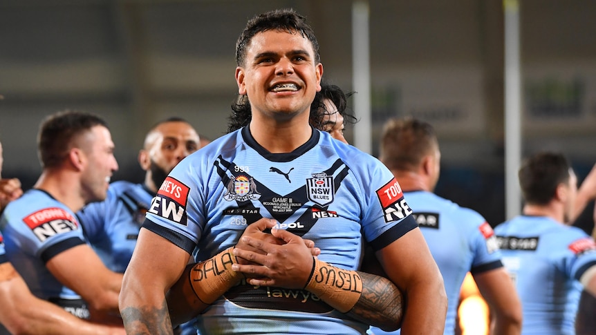 Latrell Mitchell of the Blues celebrates scoring a try