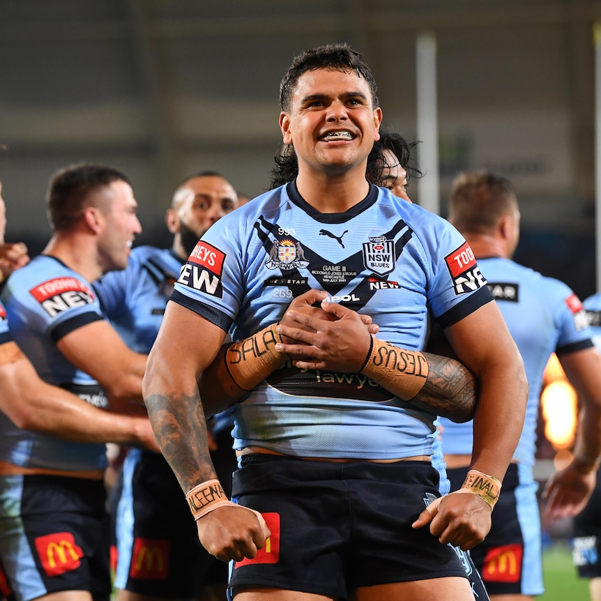 Latrell Mitchell of the Blues celebrates scoring a try
