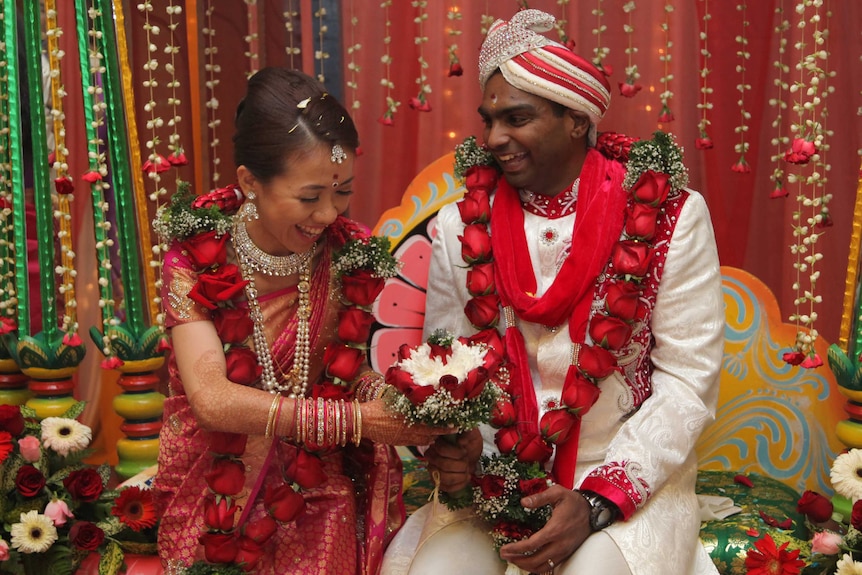 Matisse Yee and husband Vick Satgunasingam wear traditional Indian clothes at their wedding.