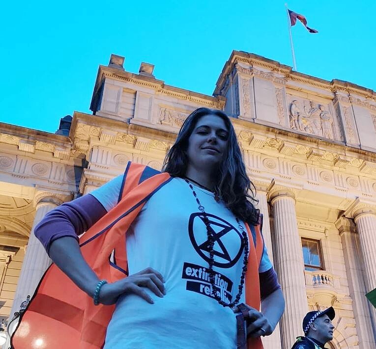 a woman standing in front of a building