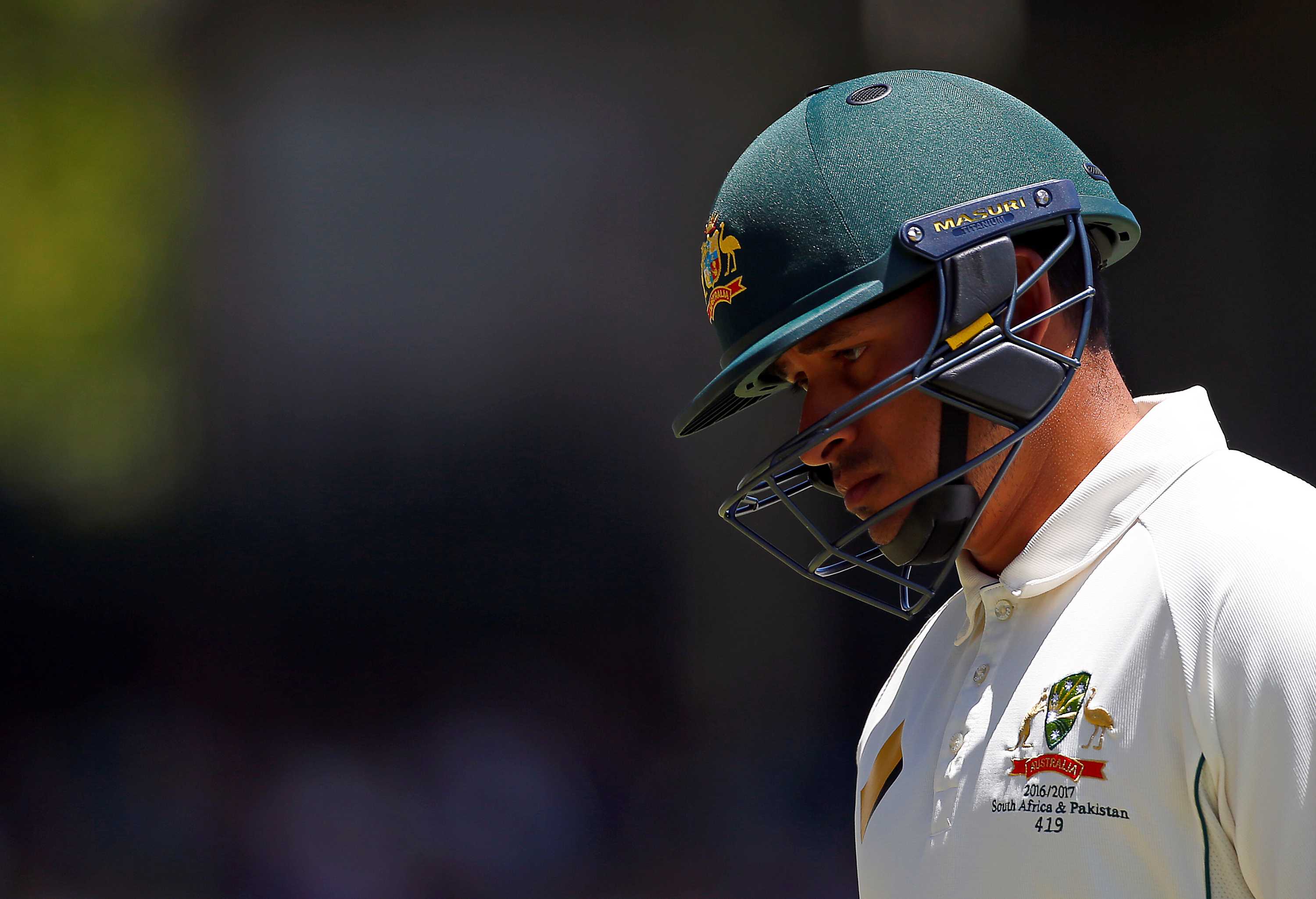 Usman Khawaja wearing his Australian helmet as he leaves the WACA dismissed by South Africa.